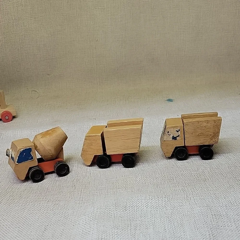Assorted small wood‎ vehicles..train, dumo truck, race cars...